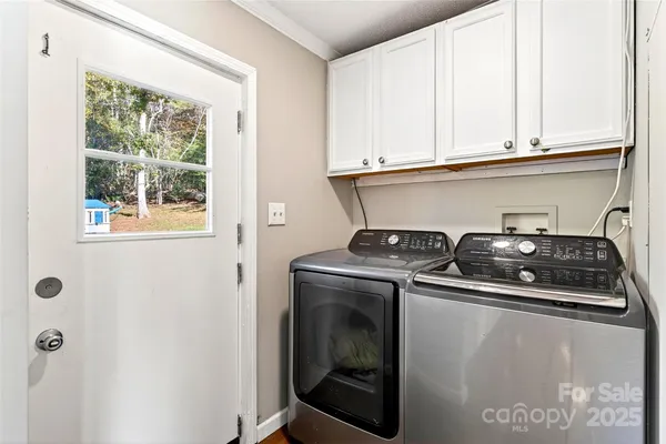 a close view of a stove top oven and cabinets