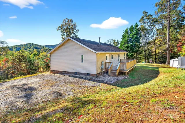 a view of a house with a yard and garage