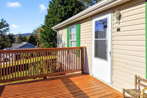 a view of a balcony with wooden floor