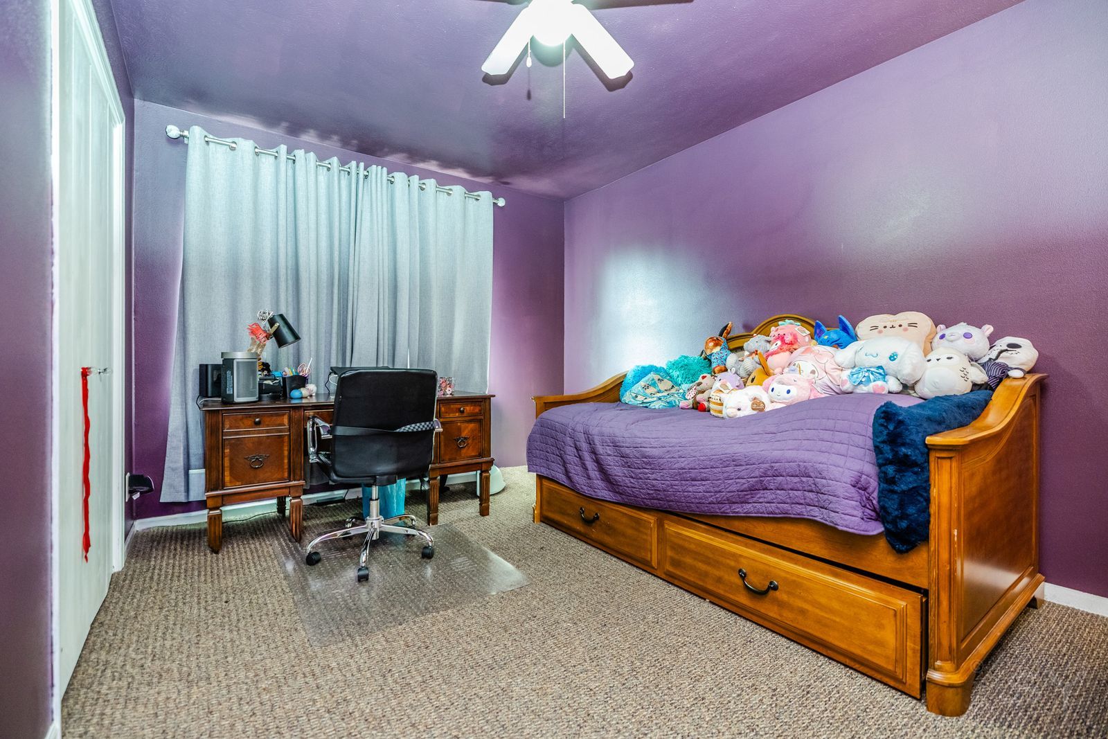 6038 Nimtz Road Loves Park, IL 61111 - Photo 16 of 26 a bedroom with a bed table chair and a chandelier