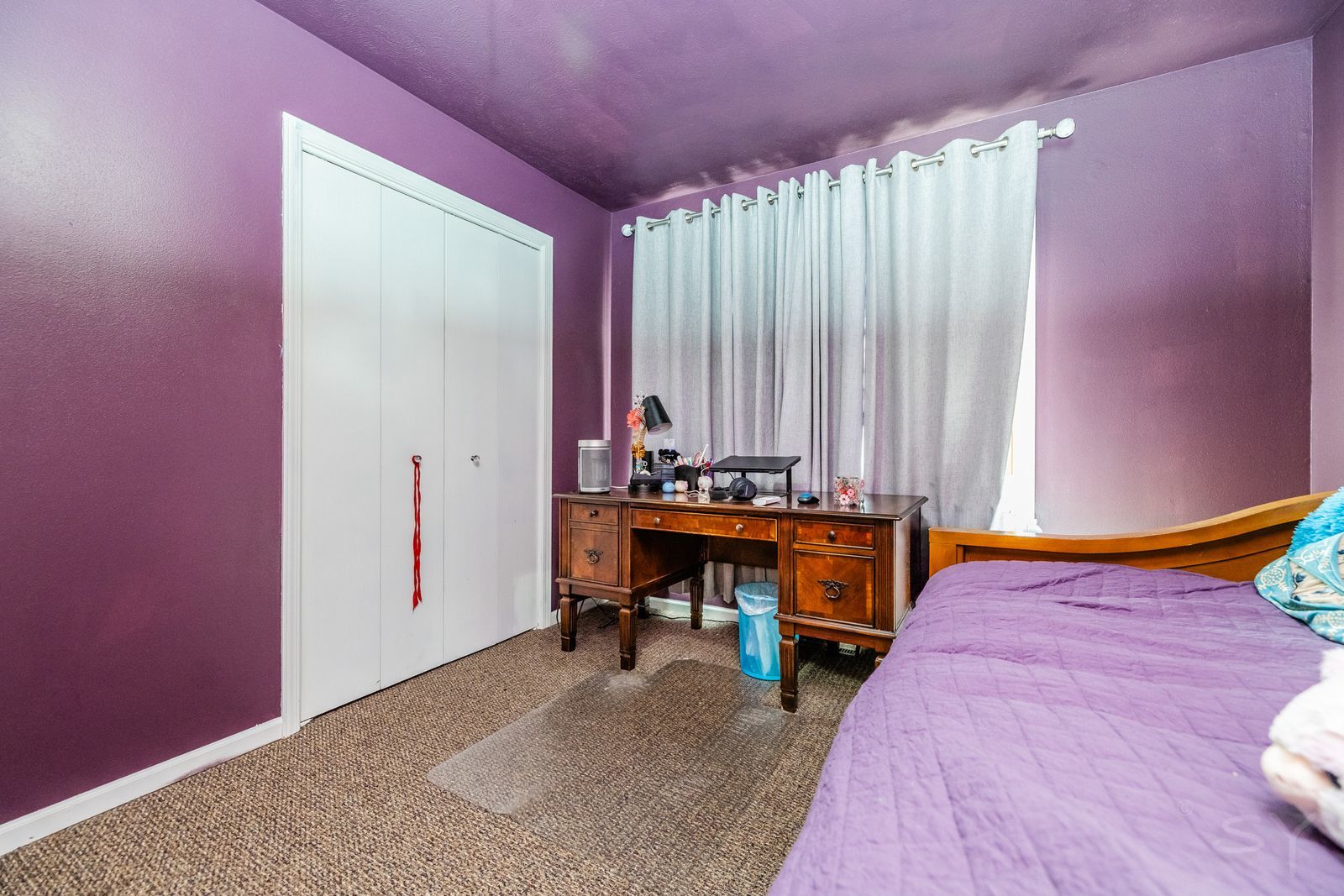 6038 Nimtz Road Loves Park, IL 61111 - Photo 17 of 26 a bedroom with a bed and a table in it