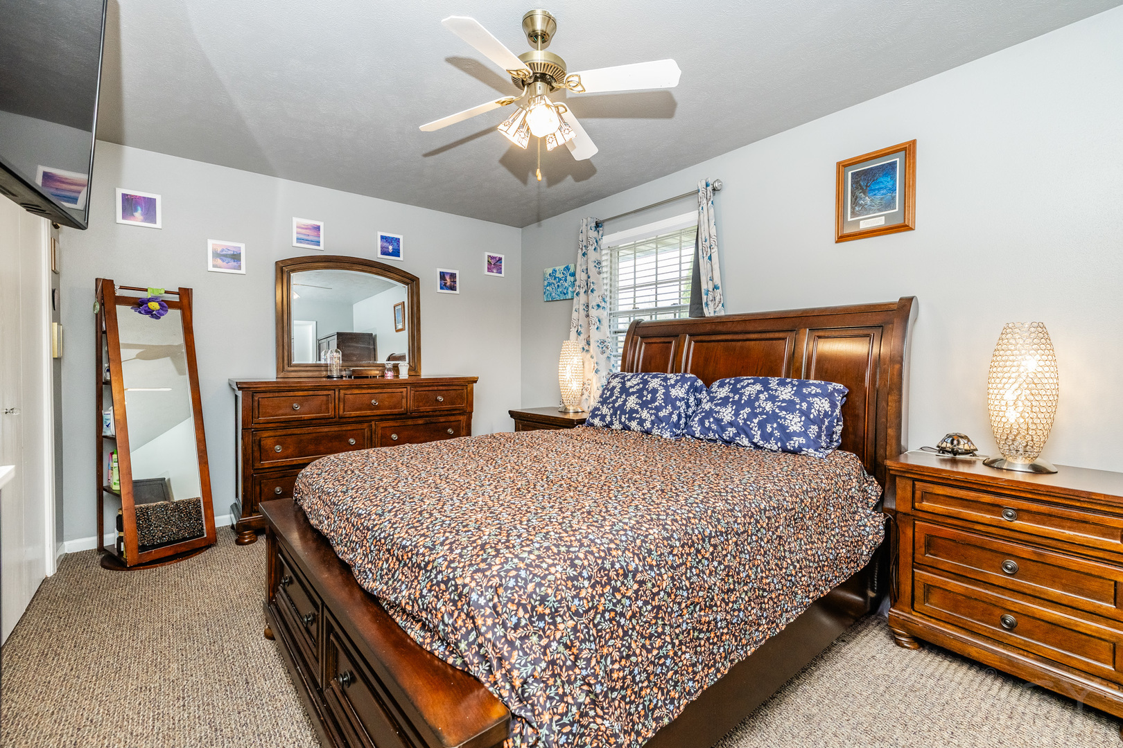 6038 Nimtz Road Loves Park, IL 61111 - Photo 20 of 26 a bedroom with bed and a chandelier