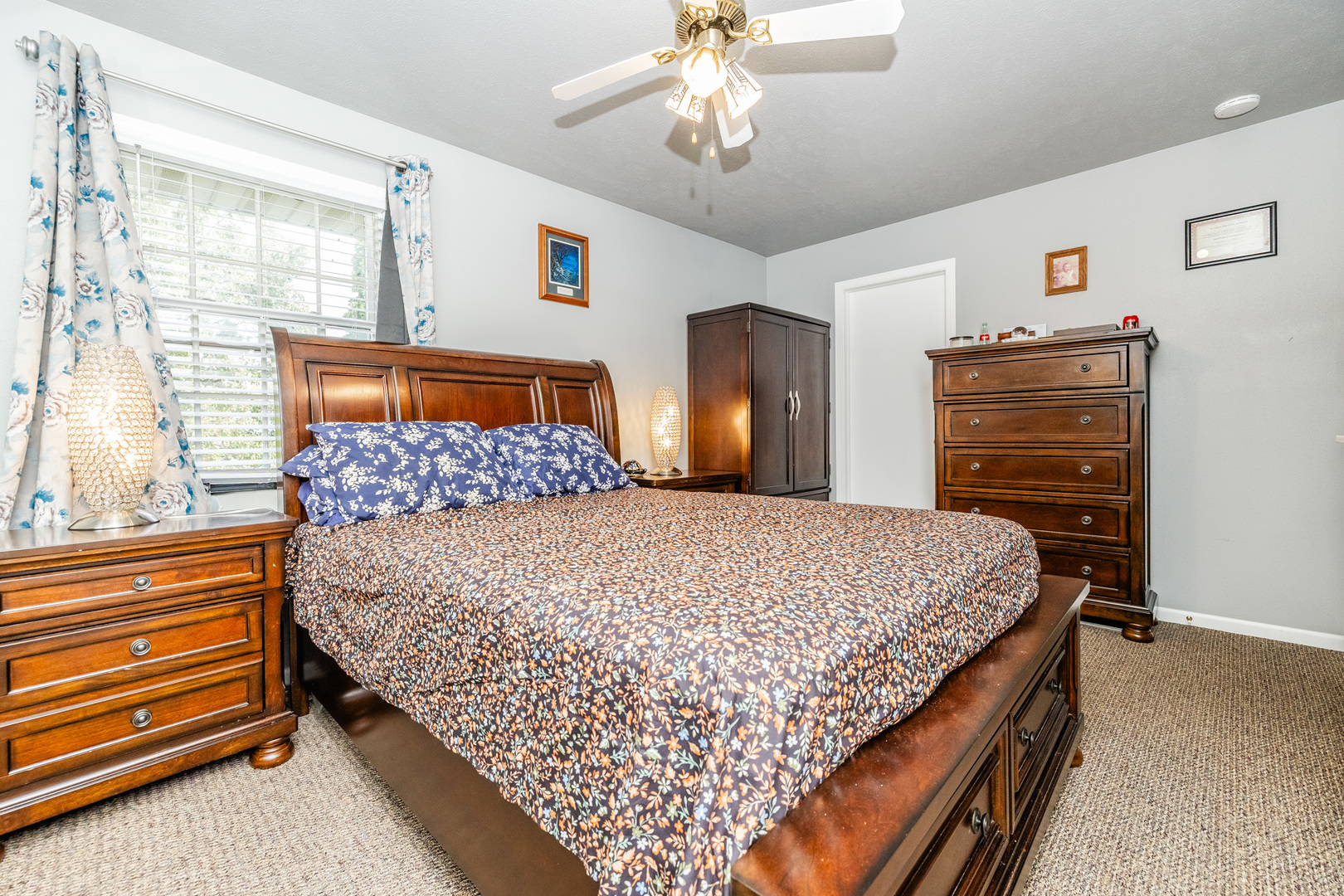 6038 Nimtz Road Loves Park, IL 61111 - Photo 21 of 26 a bedroom with a bed and dresser