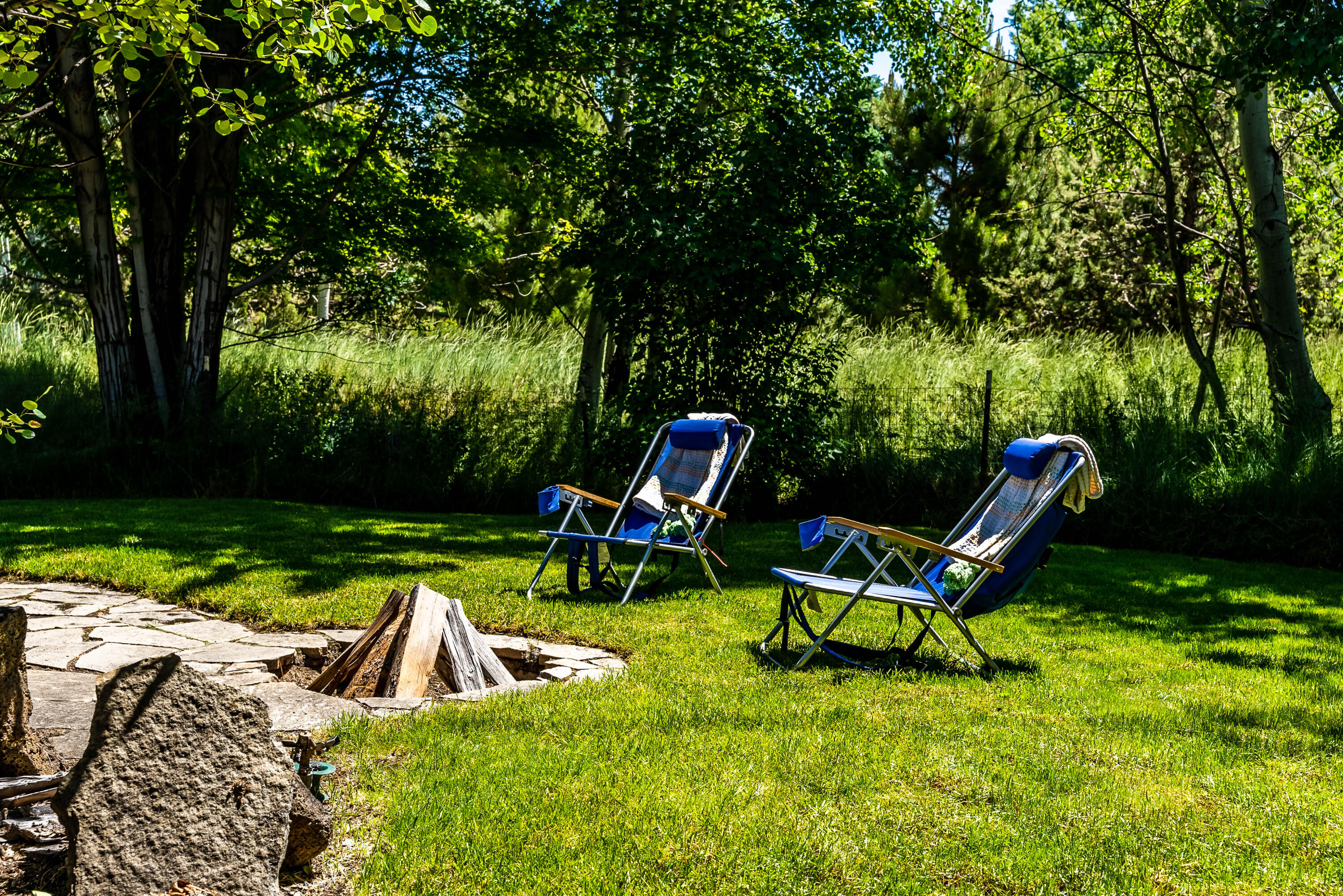 63536 Vogt Road Bend, OR 97701 - Photo 37 of 44 a view of a two chairs in a backyard