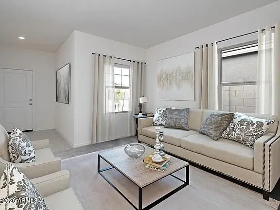 a living room with furniture and a window