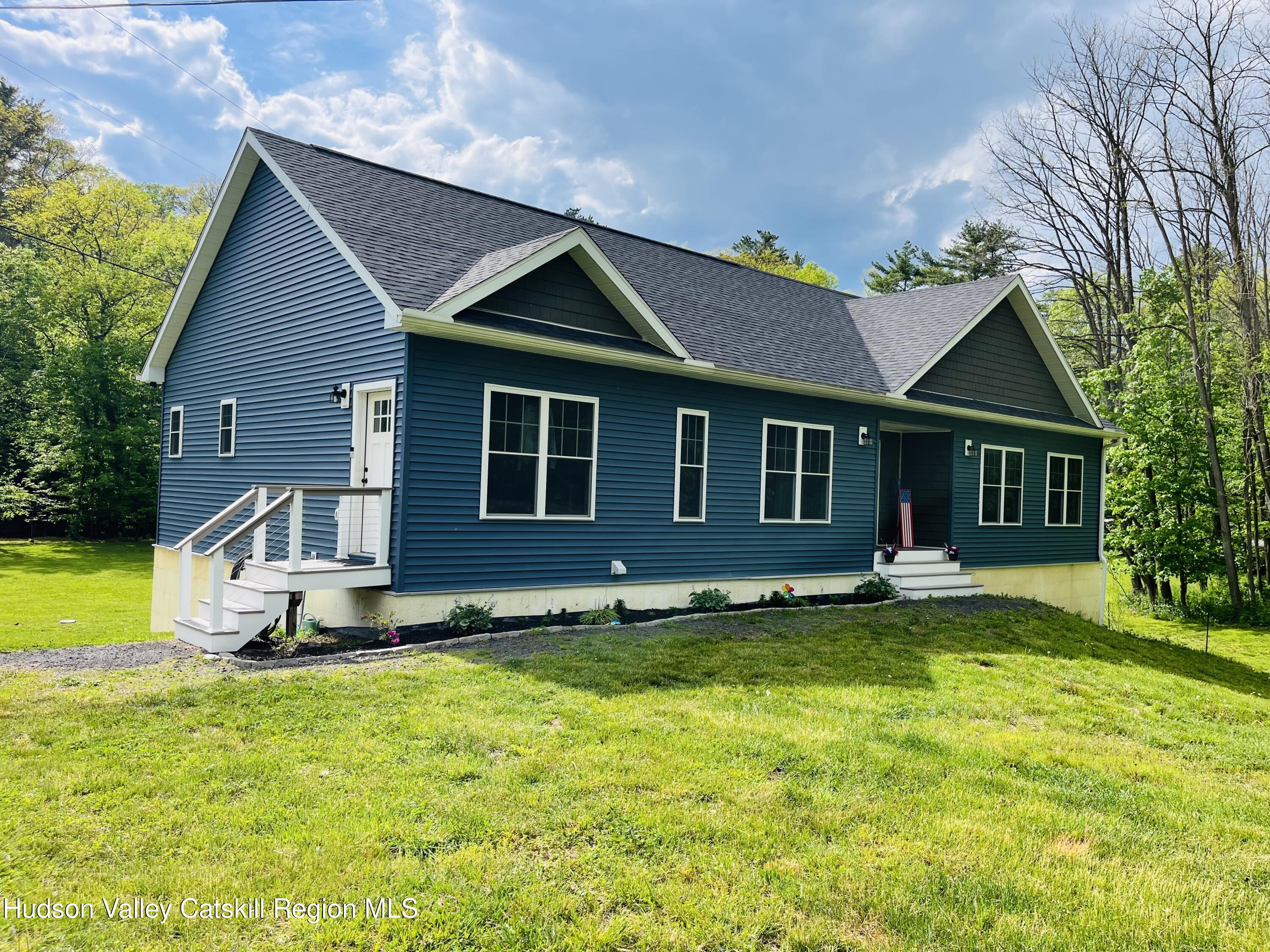 685 Sandy Plains Road Athens, NY 12451 - Photo 2 of 37 a front view of a house with a yard