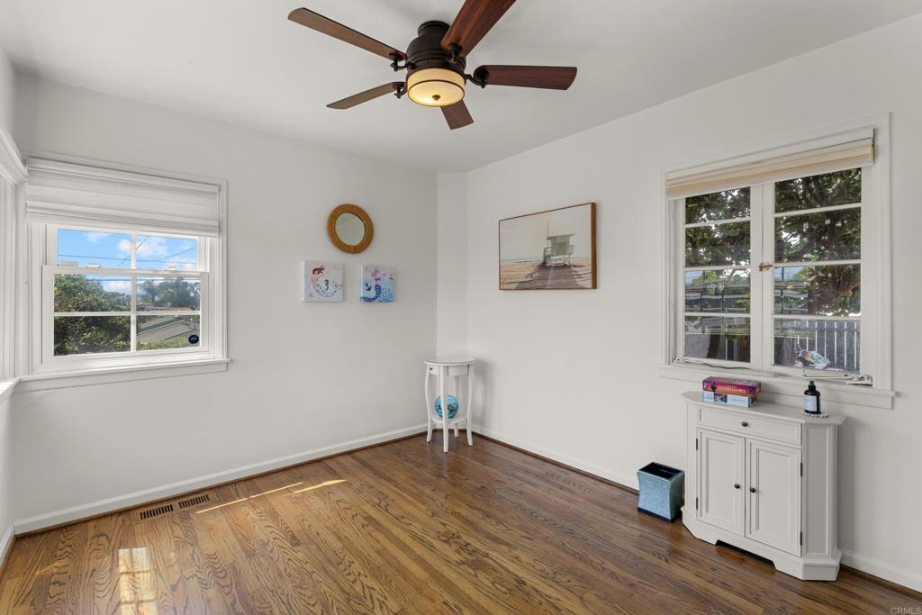 5504 Linda Rosa Avenue La Jolla, CA 92037 - Photo 12 of 24 a view of workspace with wooden floor and window