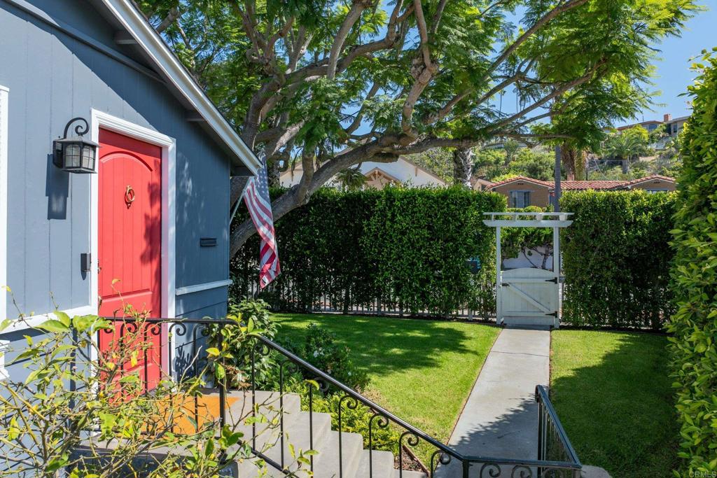 5504 Linda Rosa Avenue La Jolla, CA 92037 - Photo 22 of 24 a front view of a house with garden