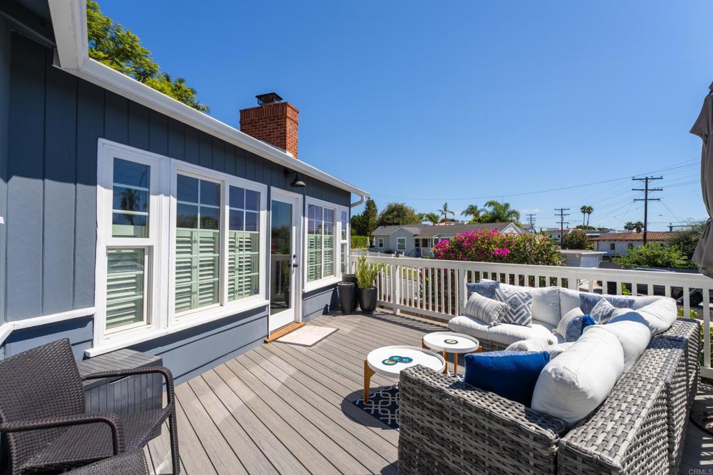5504 Linda Rosa Avenue La Jolla, CA 92037 - Photo 6 of 24 a roof deck with couches and wooden floor