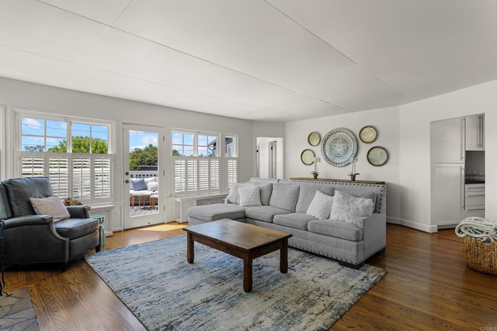 5504 Linda Rosa Avenue La Jolla, CA 92037 - Photo 8 of 24 a living room with furniture and a large window