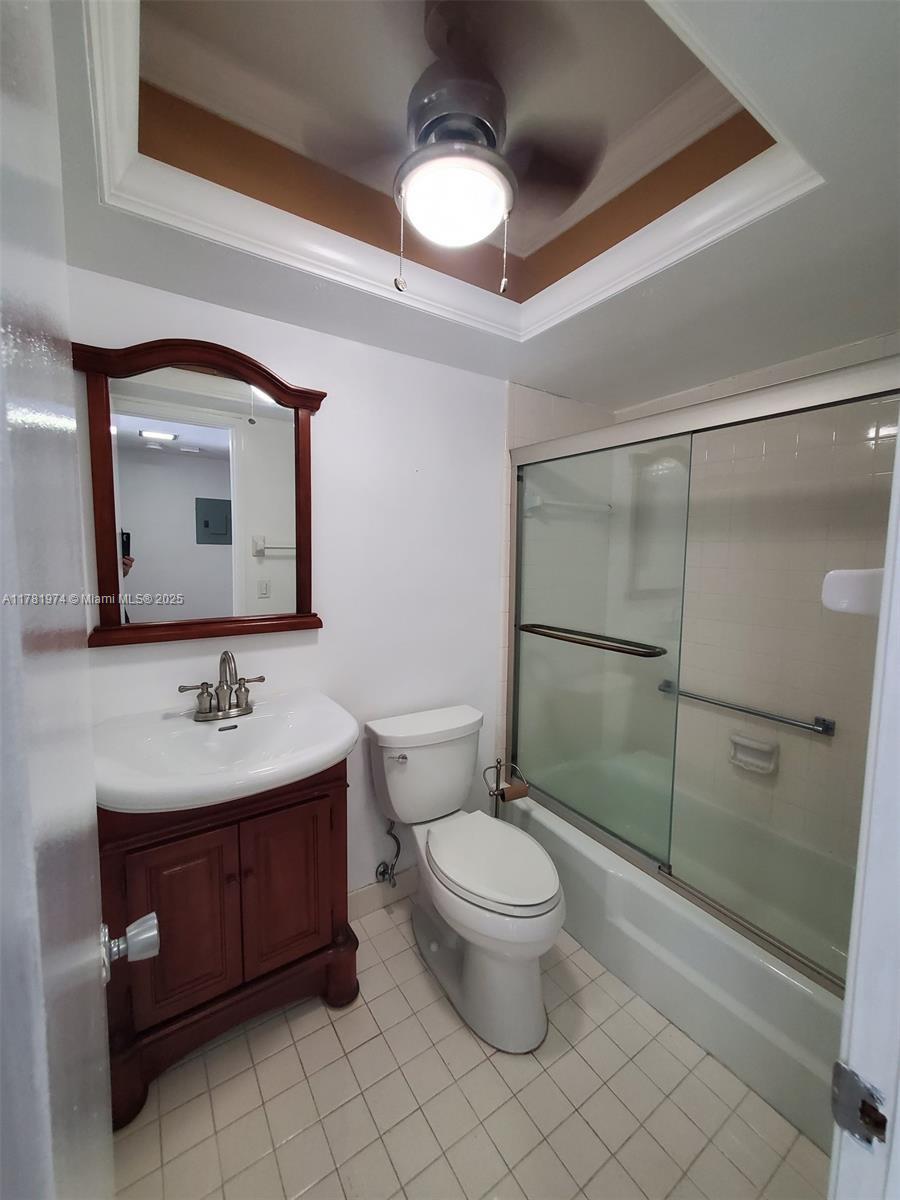 651 Pine Drive, Unit 305 Pompano Beach, FL 33060 - Photo 18 of 21 a bathroom with a toilet sink and mirror