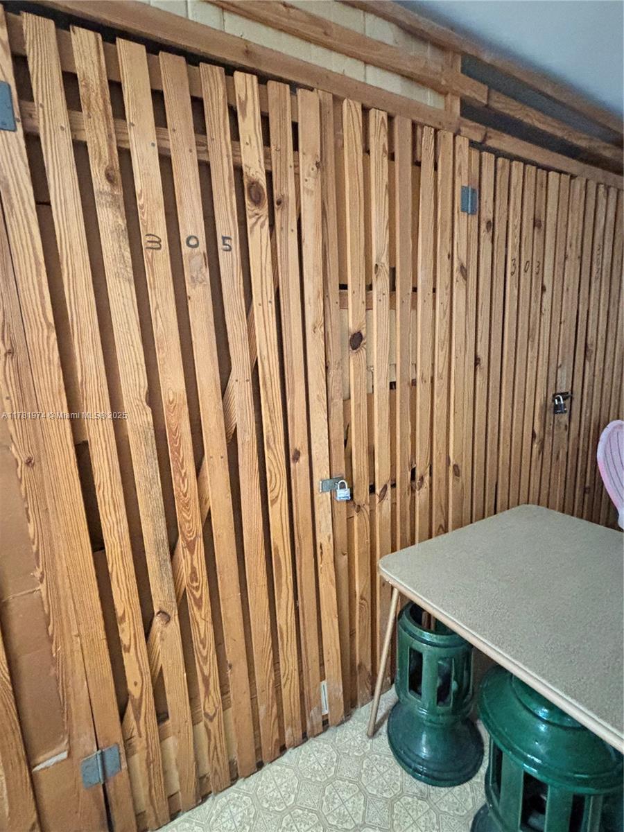 651 Pine Drive, Unit 305 Pompano Beach, FL 33060 - Photo 20 of 21 a kitchen with furniture and a potted plant