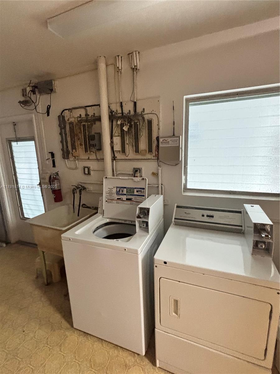 651 Pine Drive, Unit 305 Pompano Beach, FL 33060 - Photo 21 of 21 a utility room with dryer and washer