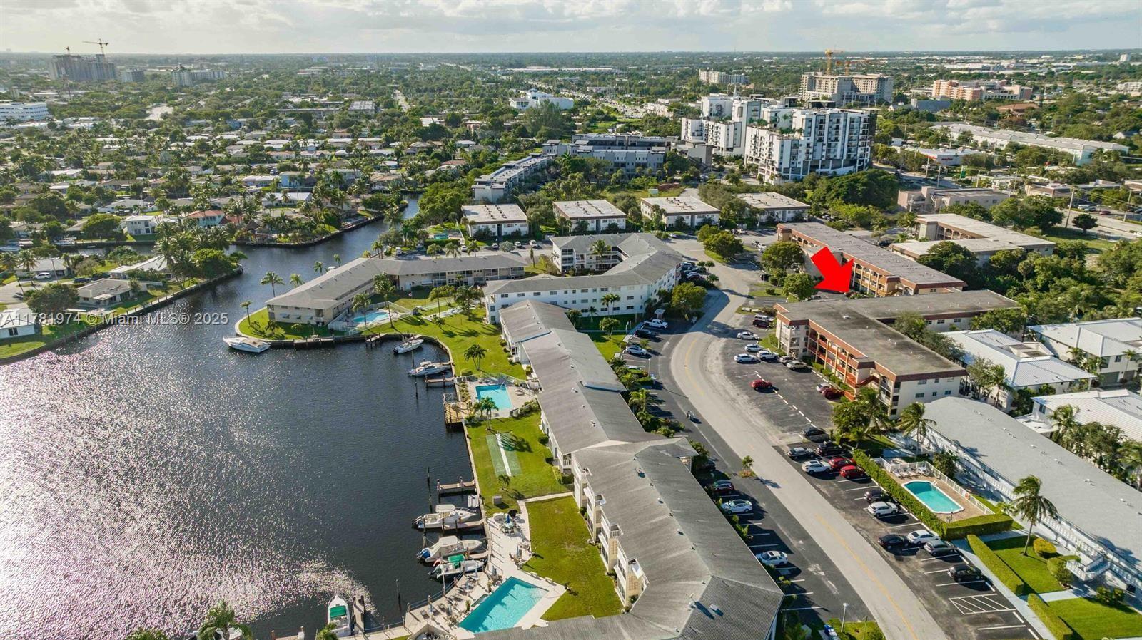 651 Pine Drive, Unit 305 Pompano Beach, FL 33060 - Photo 3 of 21 an aerial view of residential houses with outdoor space