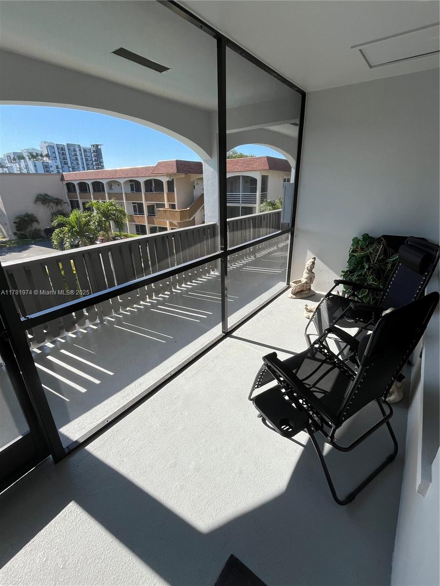 651 Pine Drive, Unit 305 Pompano Beach, FL 33060 - Photo 8 of 21 a room with gym equipment