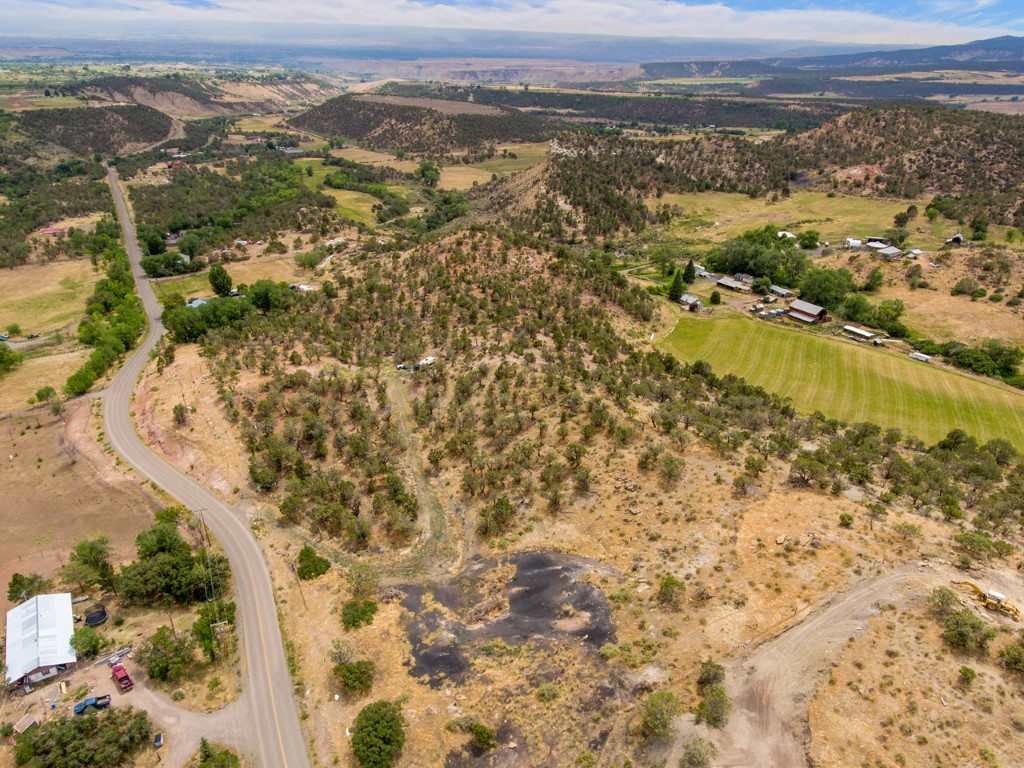19069 Green Valley Road Cedaredge, CO 81413 - Photo 21 of 34 an aerial view of residential houses with outdoor space