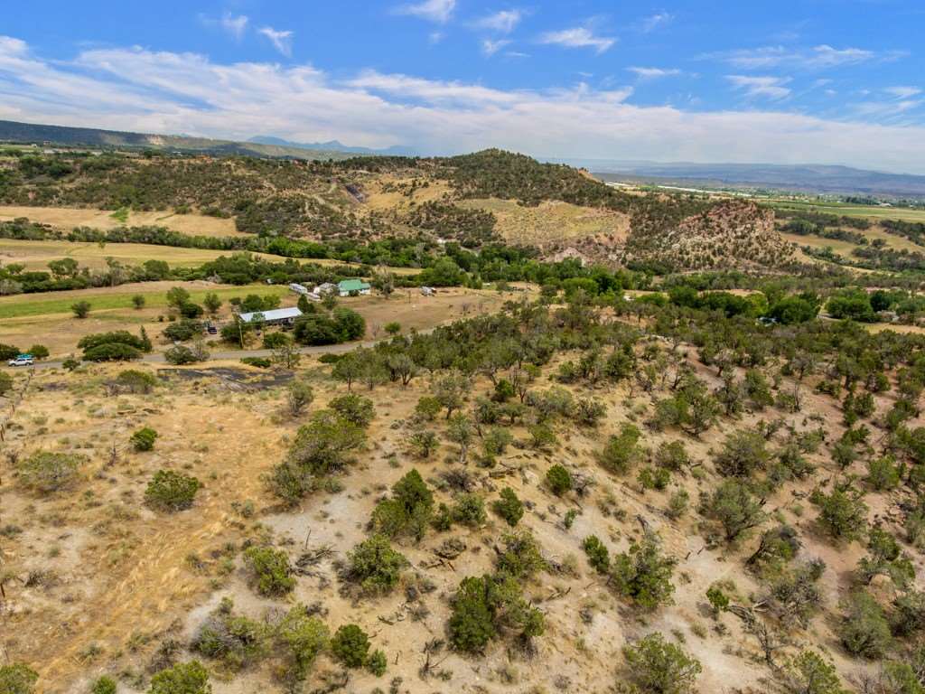 19069 Green Valley Road Cedaredge, CO 81413 - Photo 26 of 34 a view of a city with mountains in the background