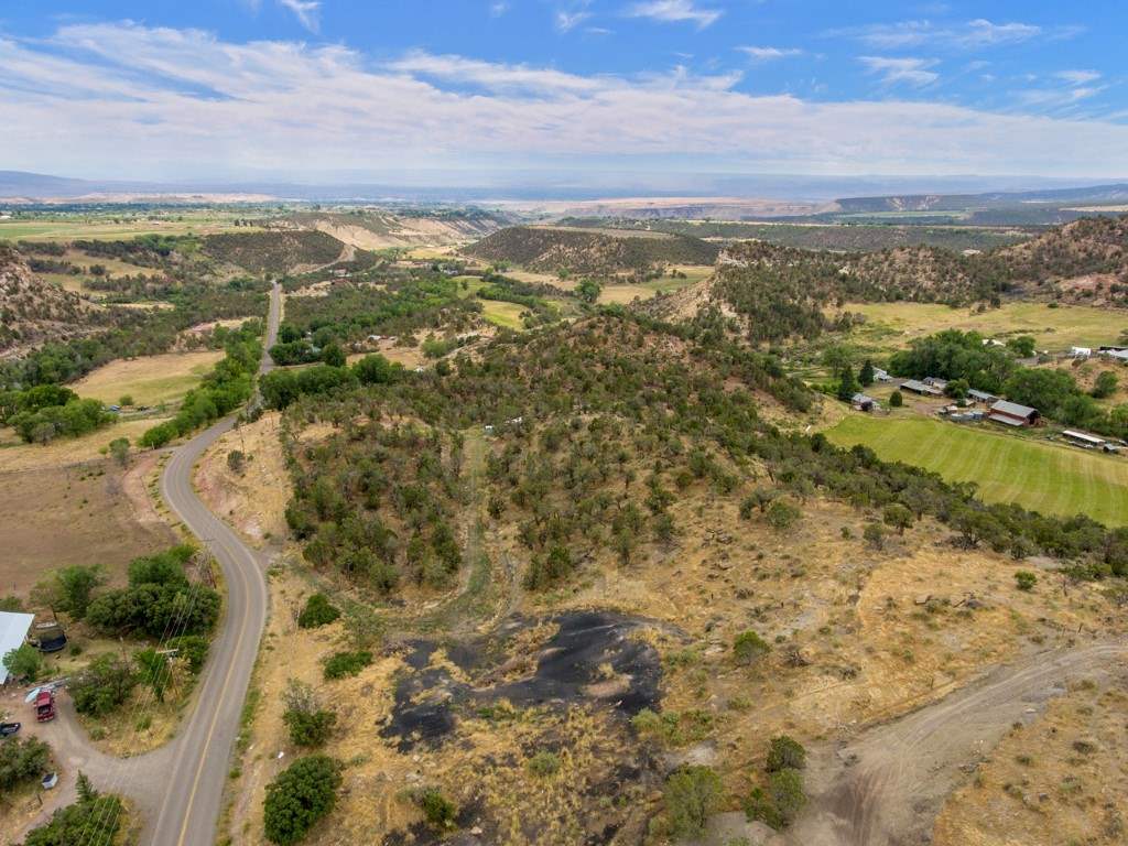 19069 Green Valley Road Cedaredge, CO 81413 - Photo 34 of 34 an aerial view of residential houses with outdoor space