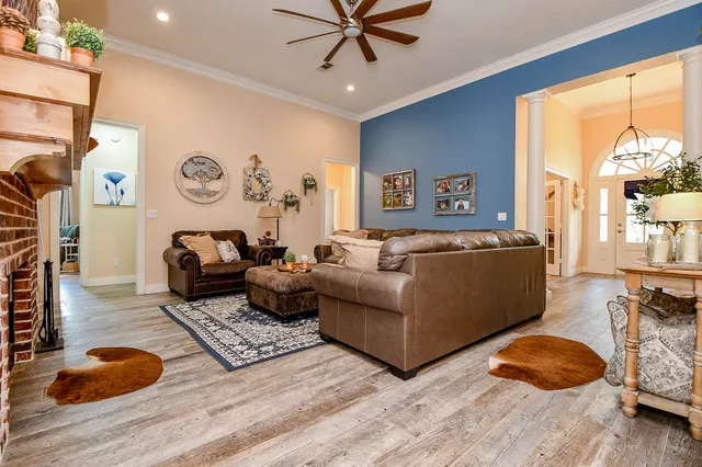 a living room with furniture and a window