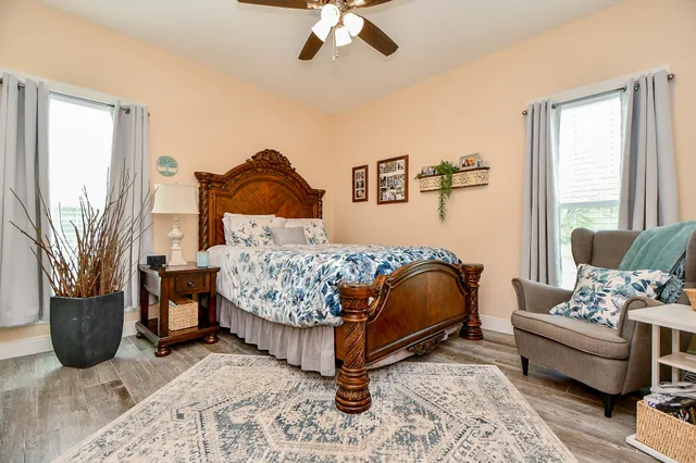 a bedroom with a bed and a couch