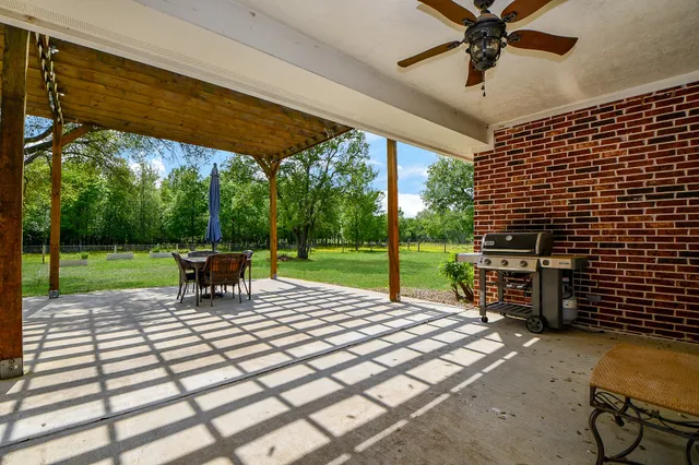 a view of a backyard with sitting area