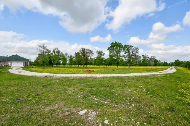 a backyard of a house with lots of green space