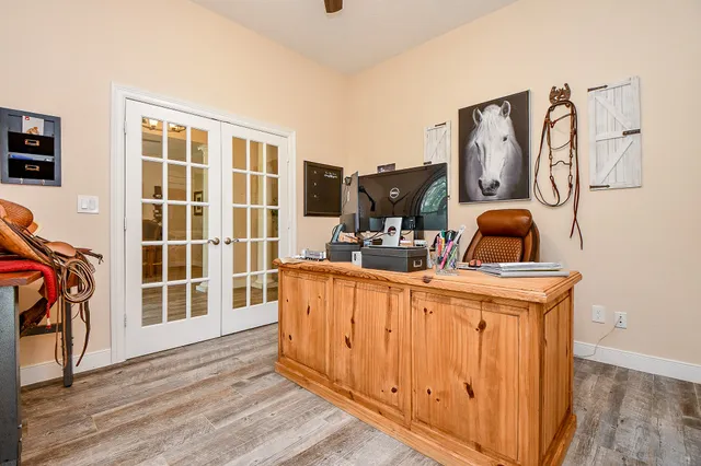 a living room with furniture a flat screen tv and a window