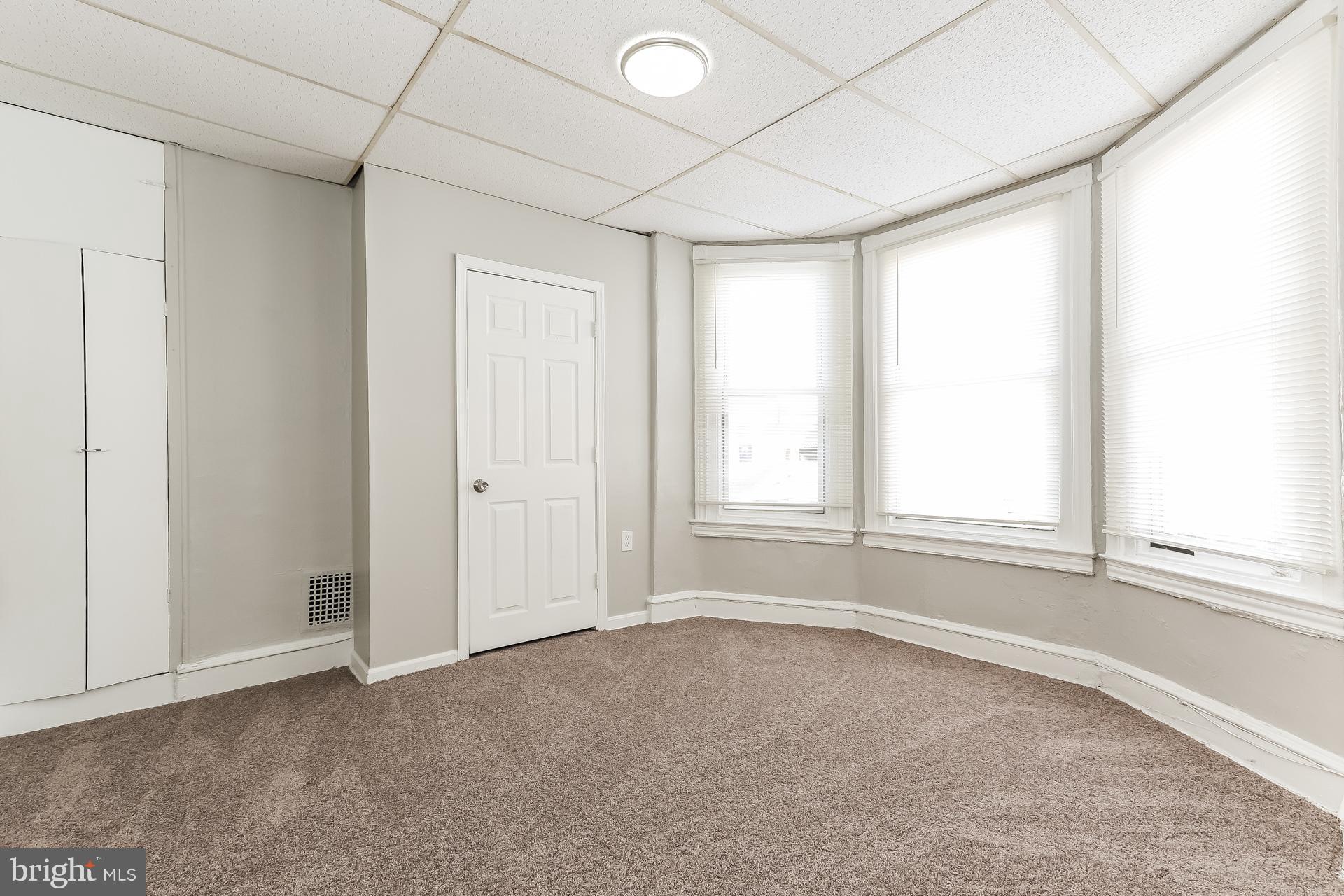 5416 Spring Street Philadelphia, PA 19139 - Photo 7 of 12 an empty room with windows and closet