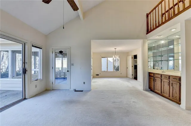 a view of a room with windows and chandelier