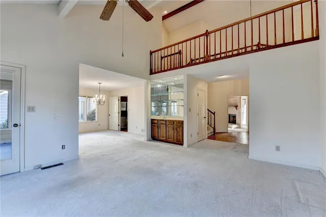 a view of a room with windows and chandelier