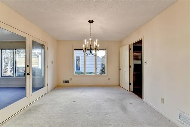 a kitchen with stainless steel appliances a sink a stove and cabinets