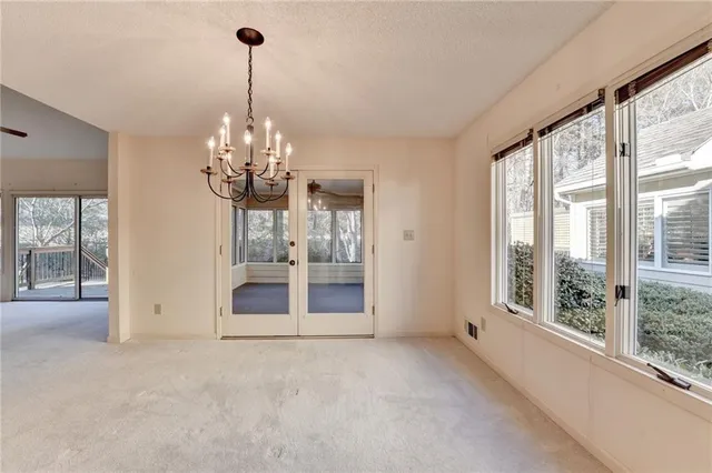 a kitchen with stainless steel appliances wooden cabinets and a stove top oven