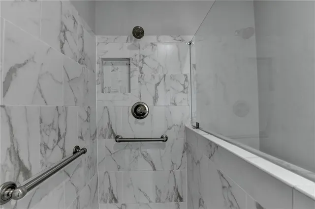 a bathroom with a sink vanity granite and toilet