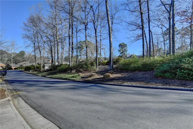 a view of a yard with cars