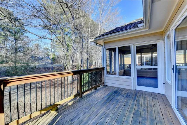 an aerial view of a house with a garden and lake view