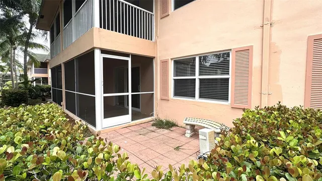 a view of a house with backyard and a slide