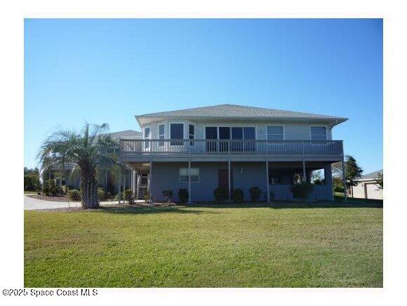 5508 Ambersand Place Grant-Valkaria, FL 32949 - Photo 1 of 30 a front view of a house with a yard
