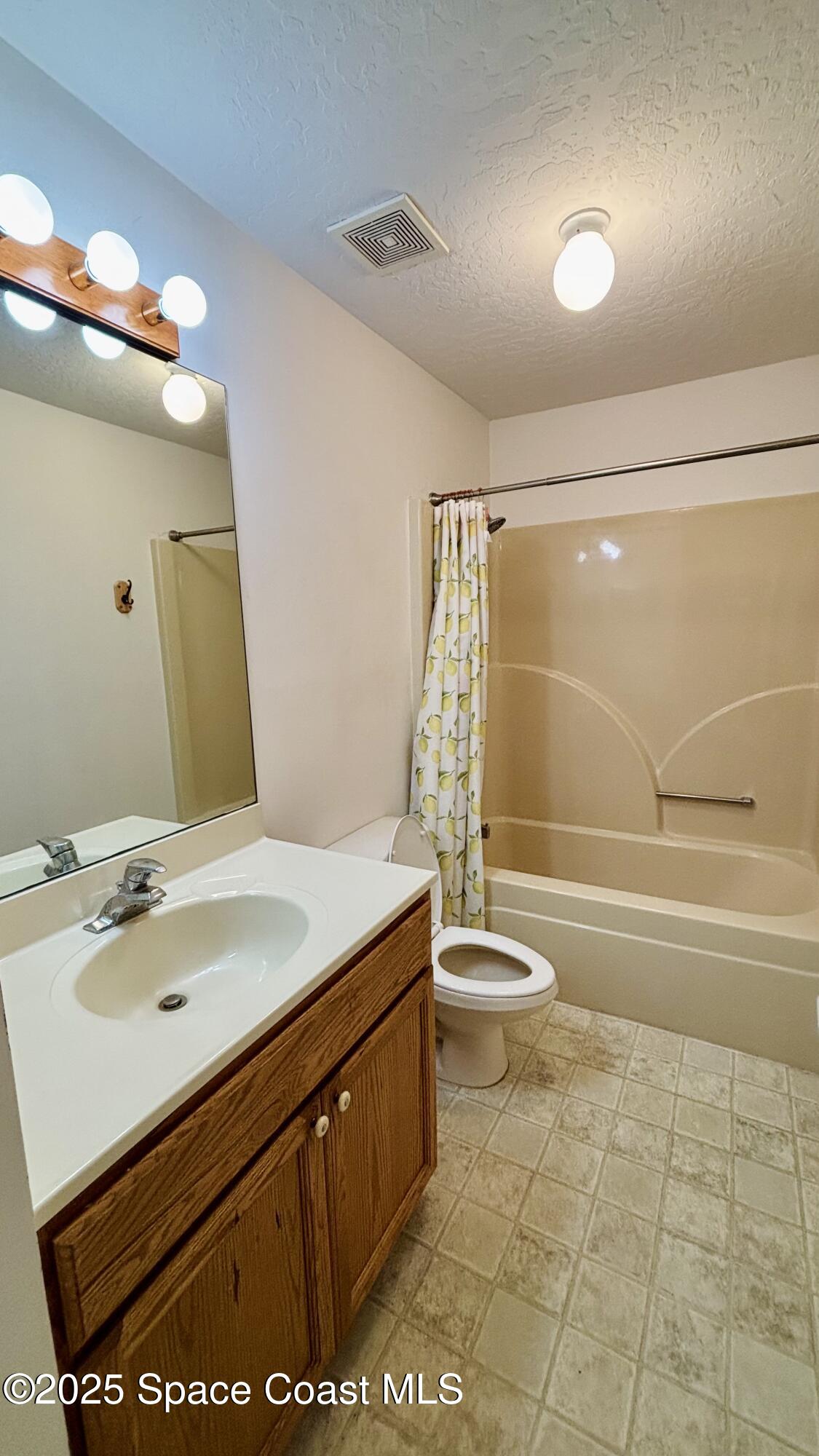 5508 Ambersand Place Grant-Valkaria, FL 32949 - Photo 16 of 30 a bathroom with a sink a toilet and shower