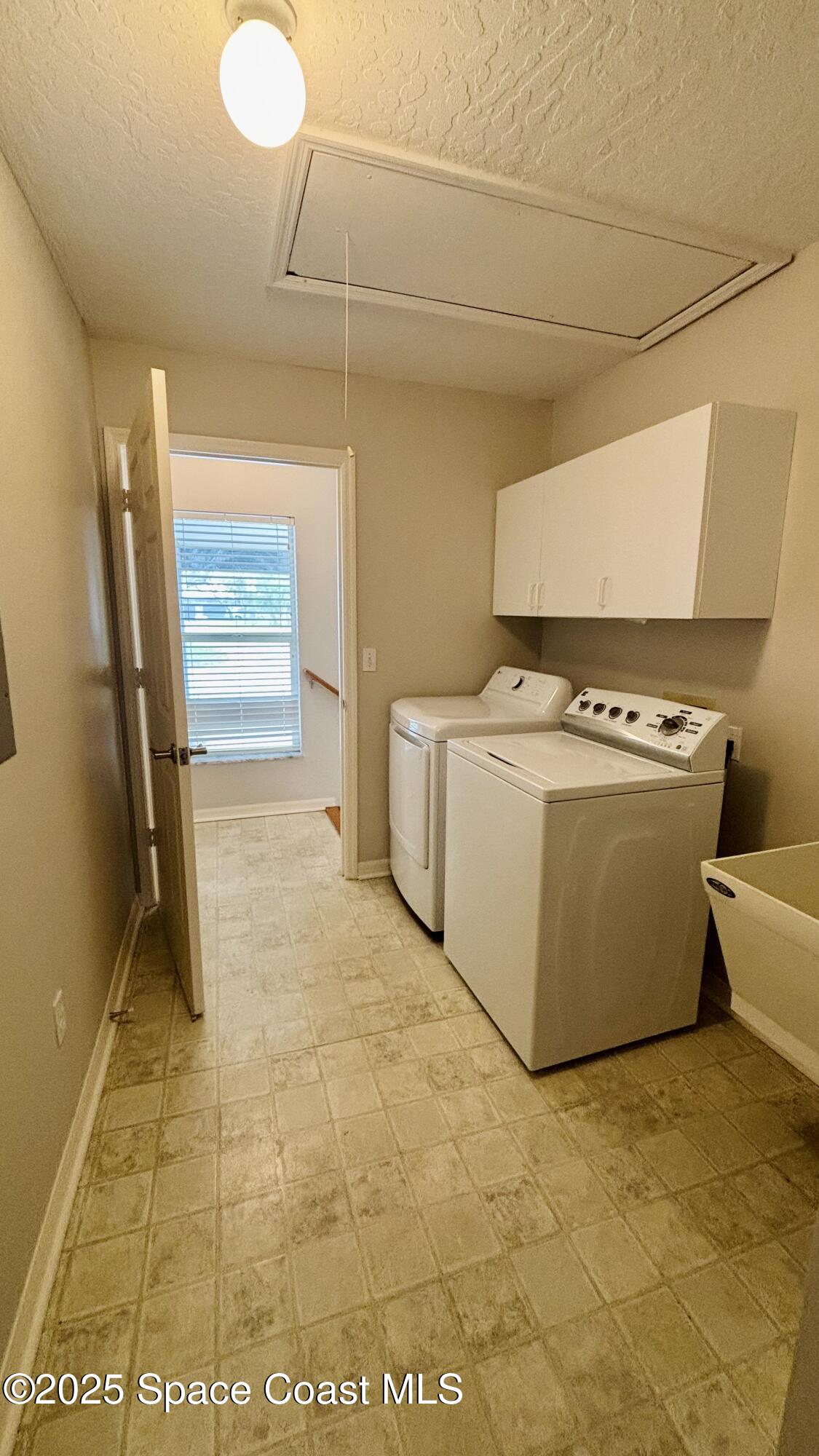 5508 Ambersand Place Grant-Valkaria, FL 32949 - Photo 21 of 30 a utility room with washer and dryer