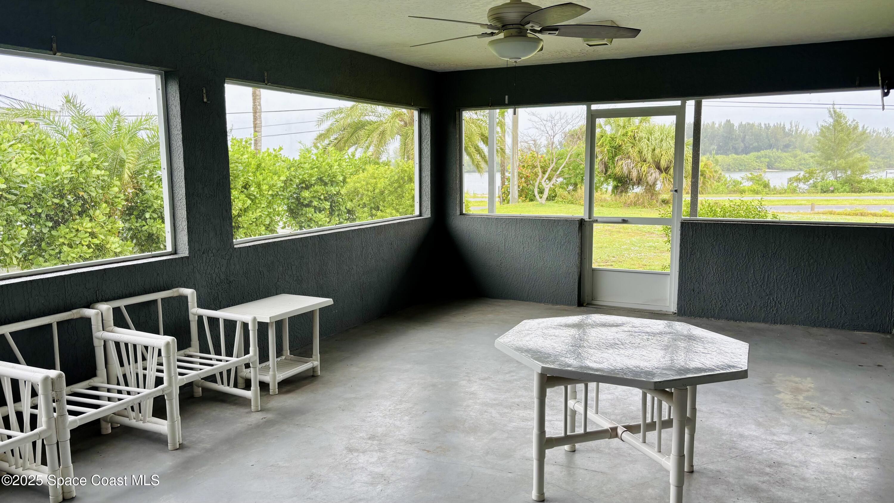 5508 Ambersand Place Grant-Valkaria, FL 32949 - Photo 22 of 30 a view of a dining room with furniture window and outside view