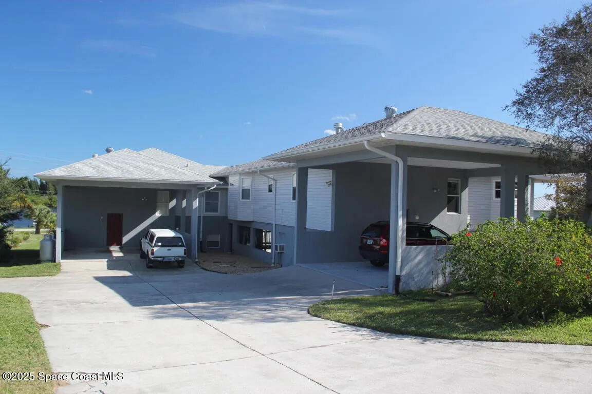 5508 Ambersand Place Grant-Valkaria, FL 32949 - Photo 24 of 30 a view of a house with patio outdoor seating space