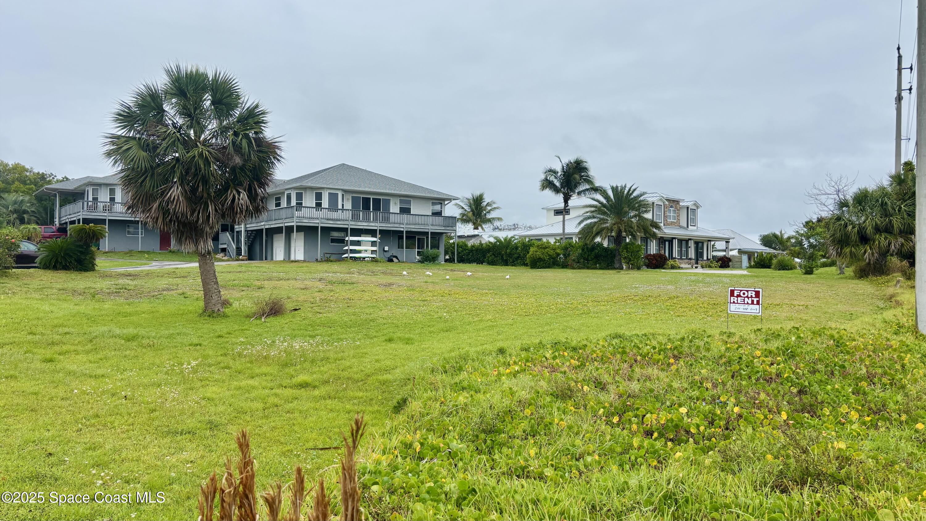 5508 Ambersand Place Grant-Valkaria, FL 32949 - Photo 27 of 30 a view of a house with a swimming pool