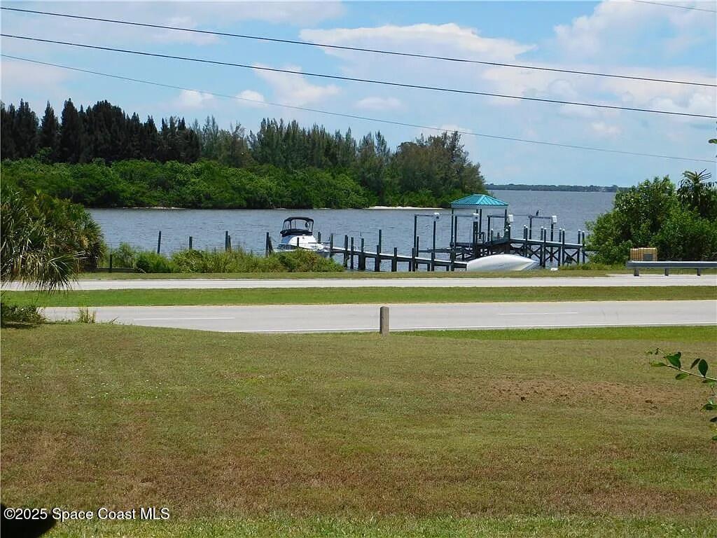 5508 Ambersand Place Grant-Valkaria, FL 32949 - Photo 30 of 30 a view of a swimming pool with a yard