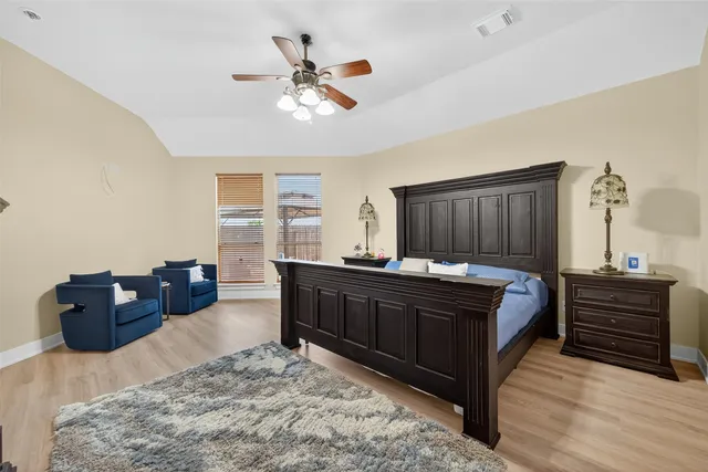 a bed room with a bed and a dresser