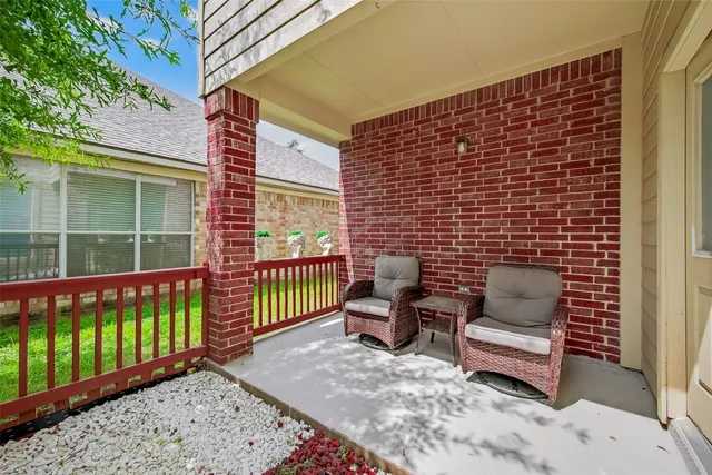 a brick building with a bench in front of it