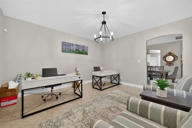 a view of a livingroom with furniture and a table