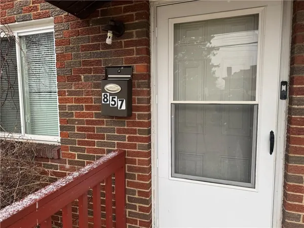 a view of a door and a street