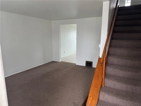 a view of a hallway with stairs