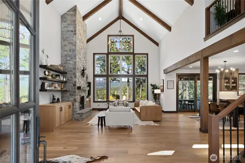 a living room with furniture and a floor to ceiling window