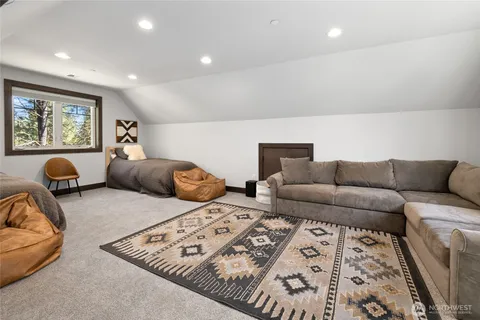 a living room with furniture and a lamp